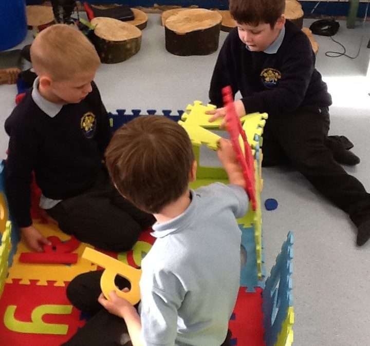 Class Willow making castles out of our giant letters